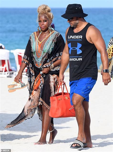 Mary J. Blige, 50, hits Miami Beach in tiny string bikini.